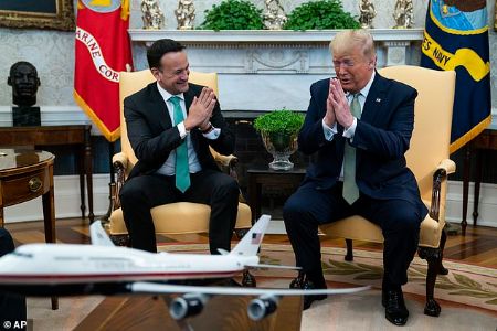 trump with the irish prime minister doing namaste to one another 